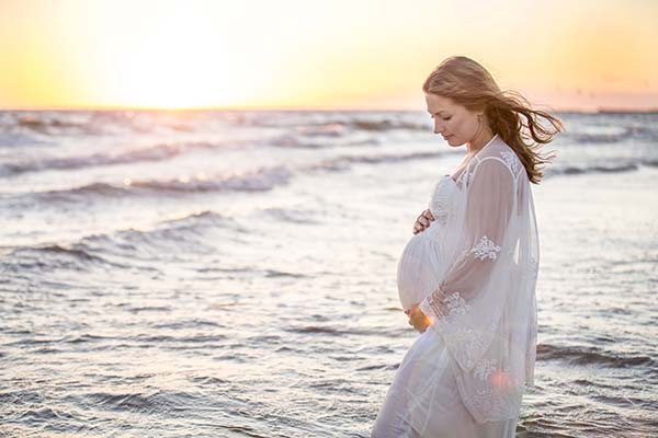 Sunset pregnant woman